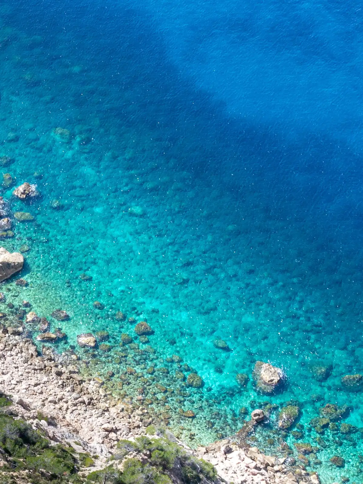 Rocky coastline of the Serra de Tramuntana with turquoise sea, Mallorca